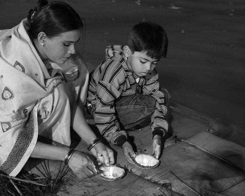 Learning to worship the water bodies at an early age at Triveni - the confluence of rivers Ganga, Yamuna and mythical Saraswati - in Prayag (Allahabad), Uttar Pradesh